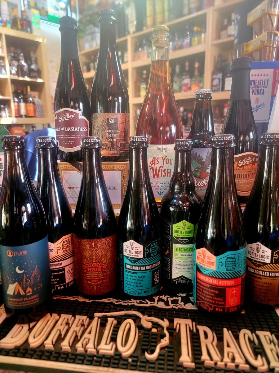 Barrel-aged stouts and sour beers from Bottle Logic, The Bruery, and other craft breweries on the store counter