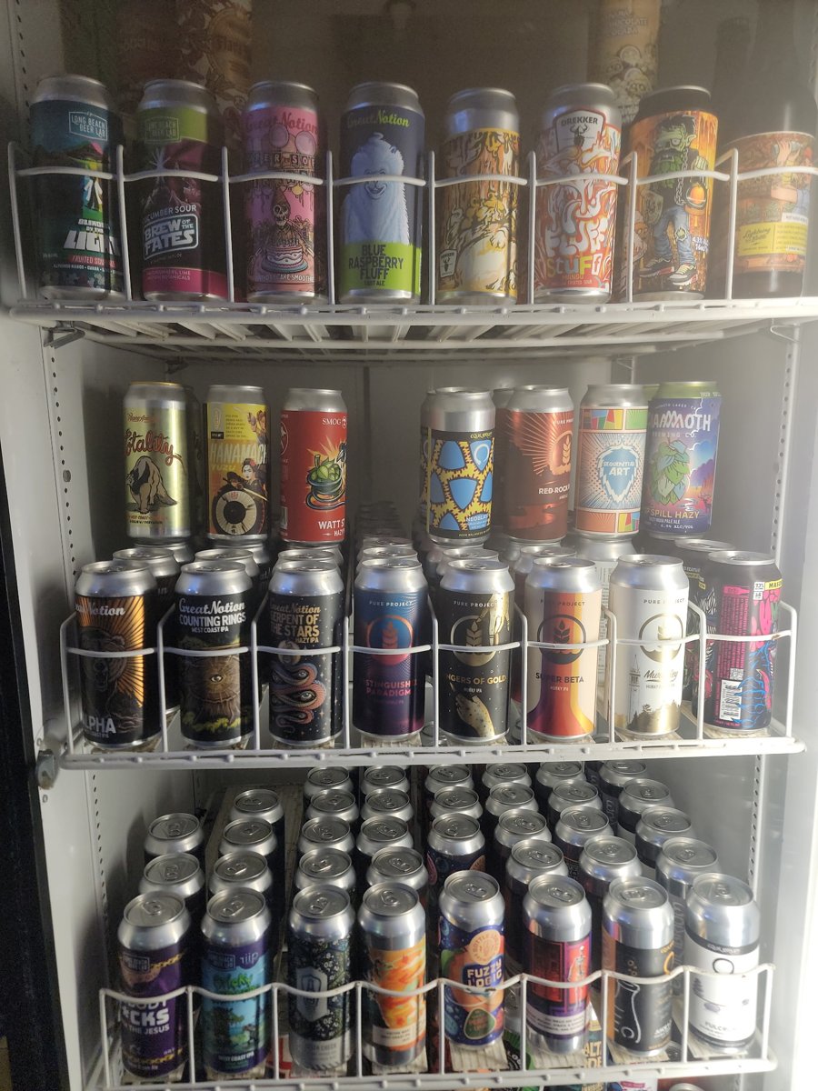 Craft beer and IPA cans on the cooler shelves at Home of the Hangover