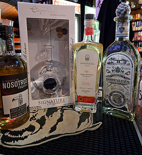 Curated tequila bottles including Nosotros, Esperanza, Santalfeza, and Fortaleza on the store counter