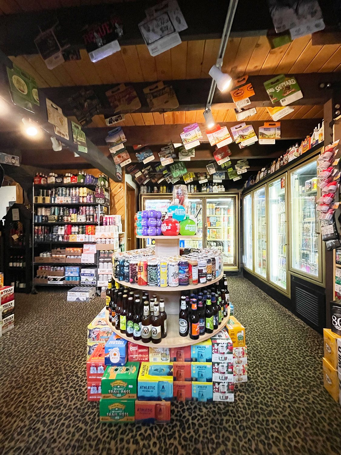 Wide view of Home of the Hangover's craft beer selection inside the store